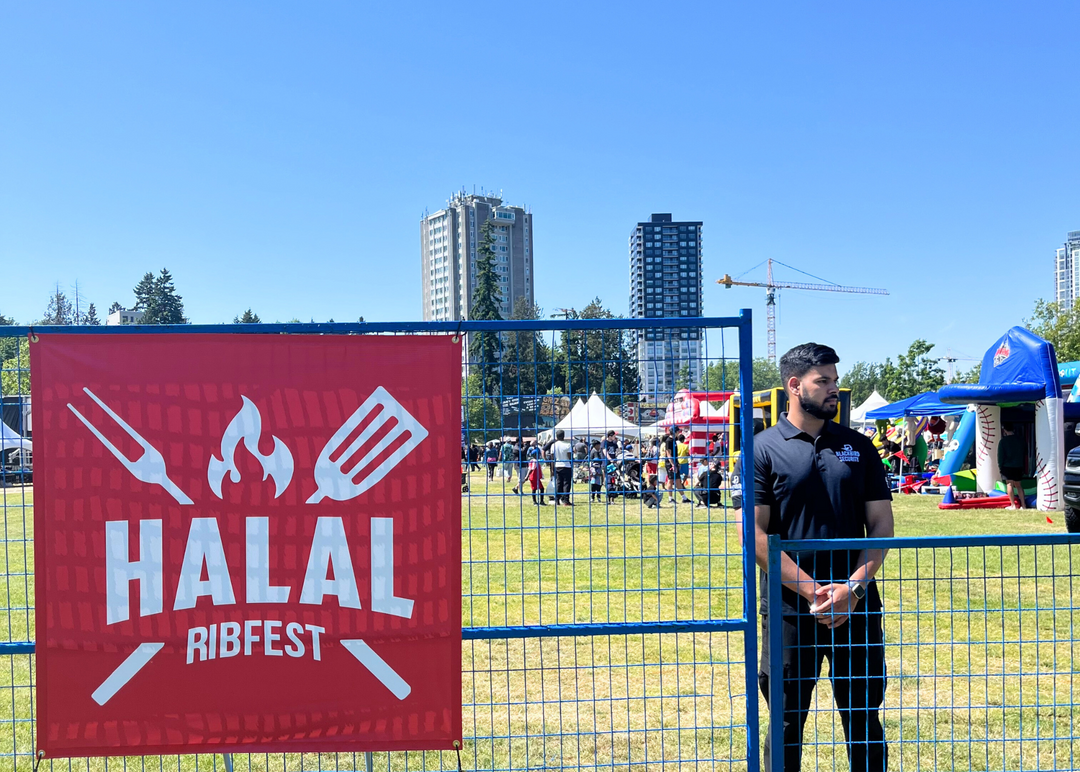 Uniformed Blackbird security guard standing in front of event gate