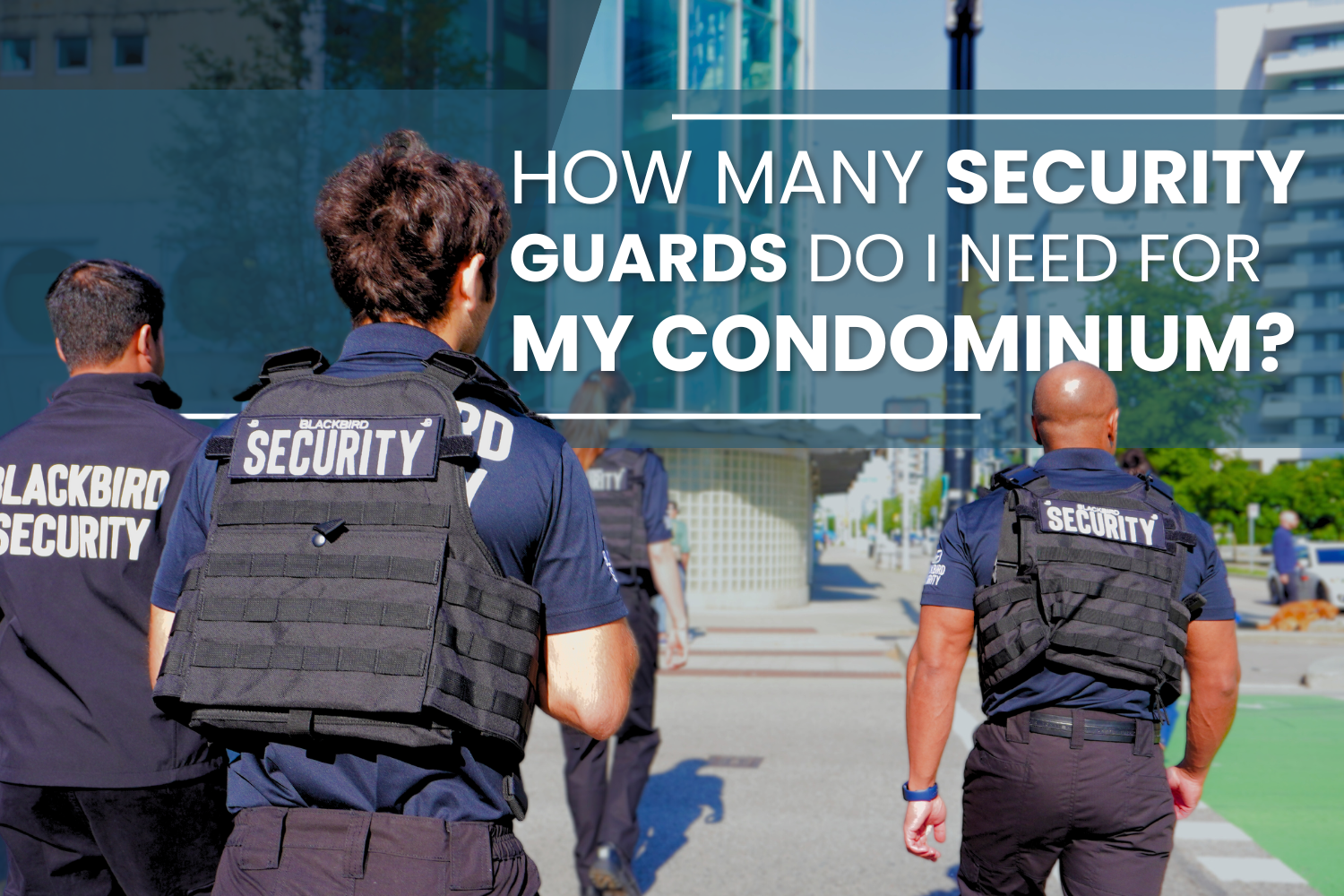 Four Uniformed Blackbird security guard patrolling outside a building