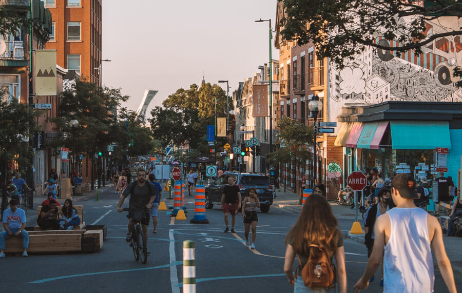 People walking on street in Montreal in summer