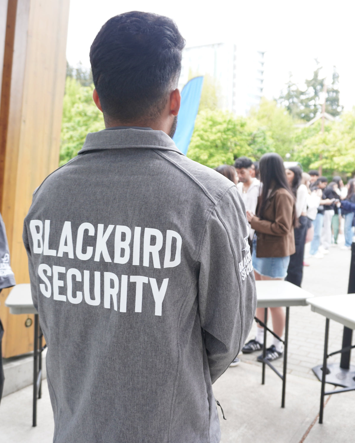 Blackbird Security Uniform Security Guard performing line control at a Bryson Tiller concert in Vancouver, BC.