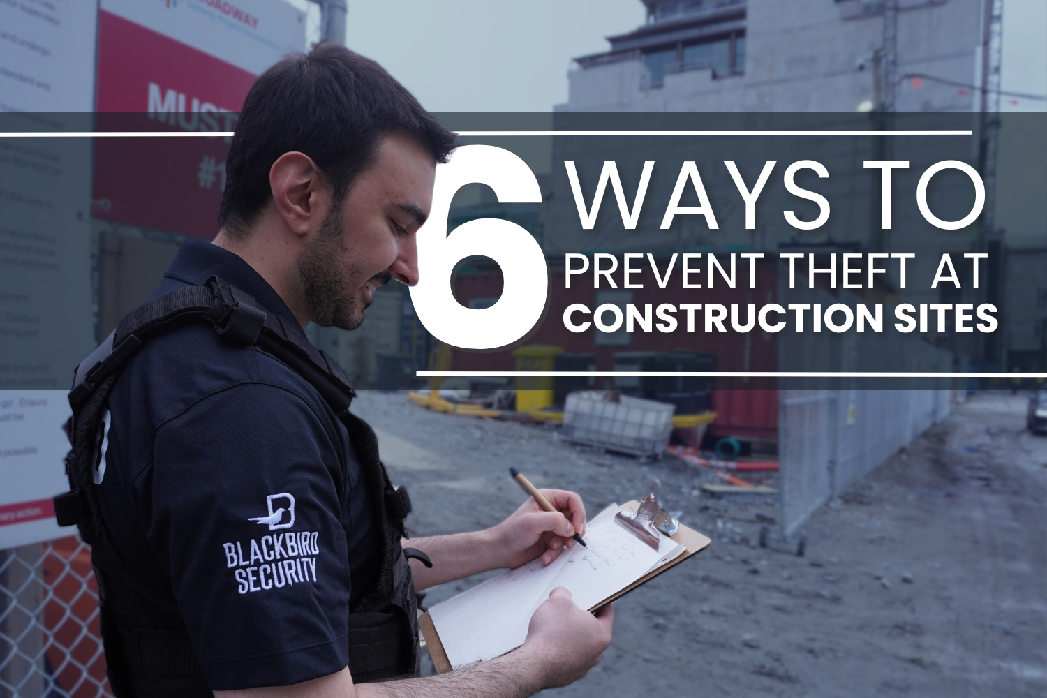 Uniformed Blackbird security guards standing  in front of construction site with clipboard
