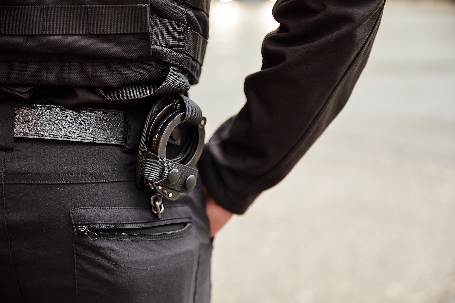 security guard with handcuffs on belt
