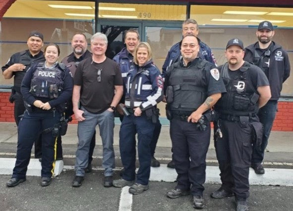 Blackbird security guards and police officers standing outside building