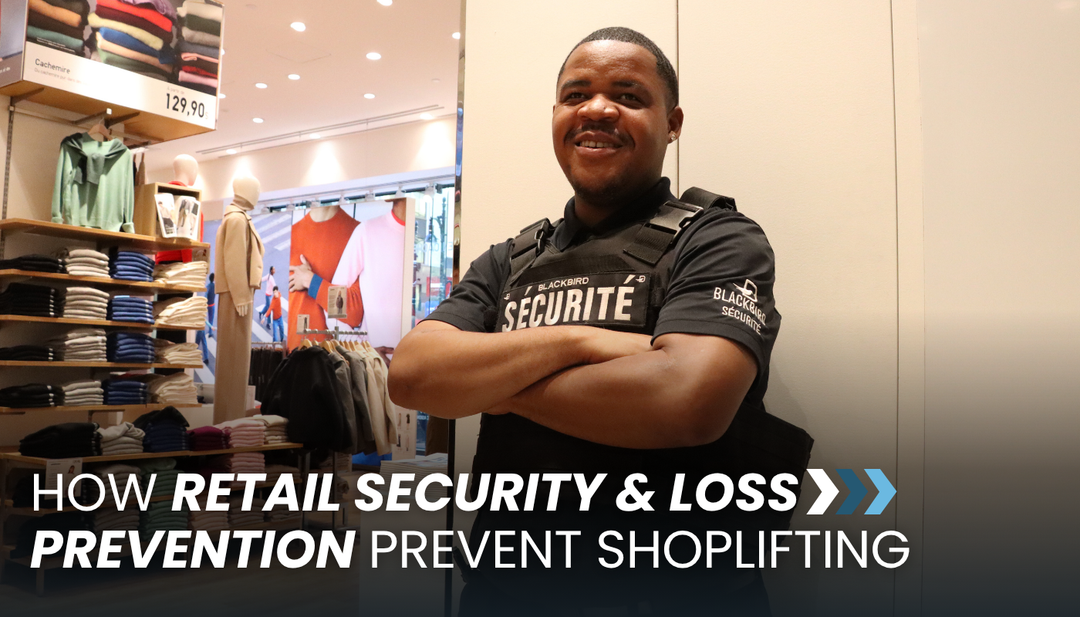 A security guard in a clothing store poses for the camera