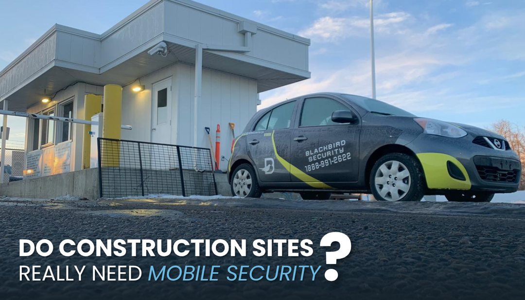 A Blackbird Security mobile patrol vehicle in front of a construction site gatehouse.