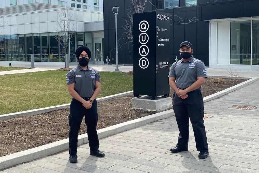 Two security guards outside the Quad at York.