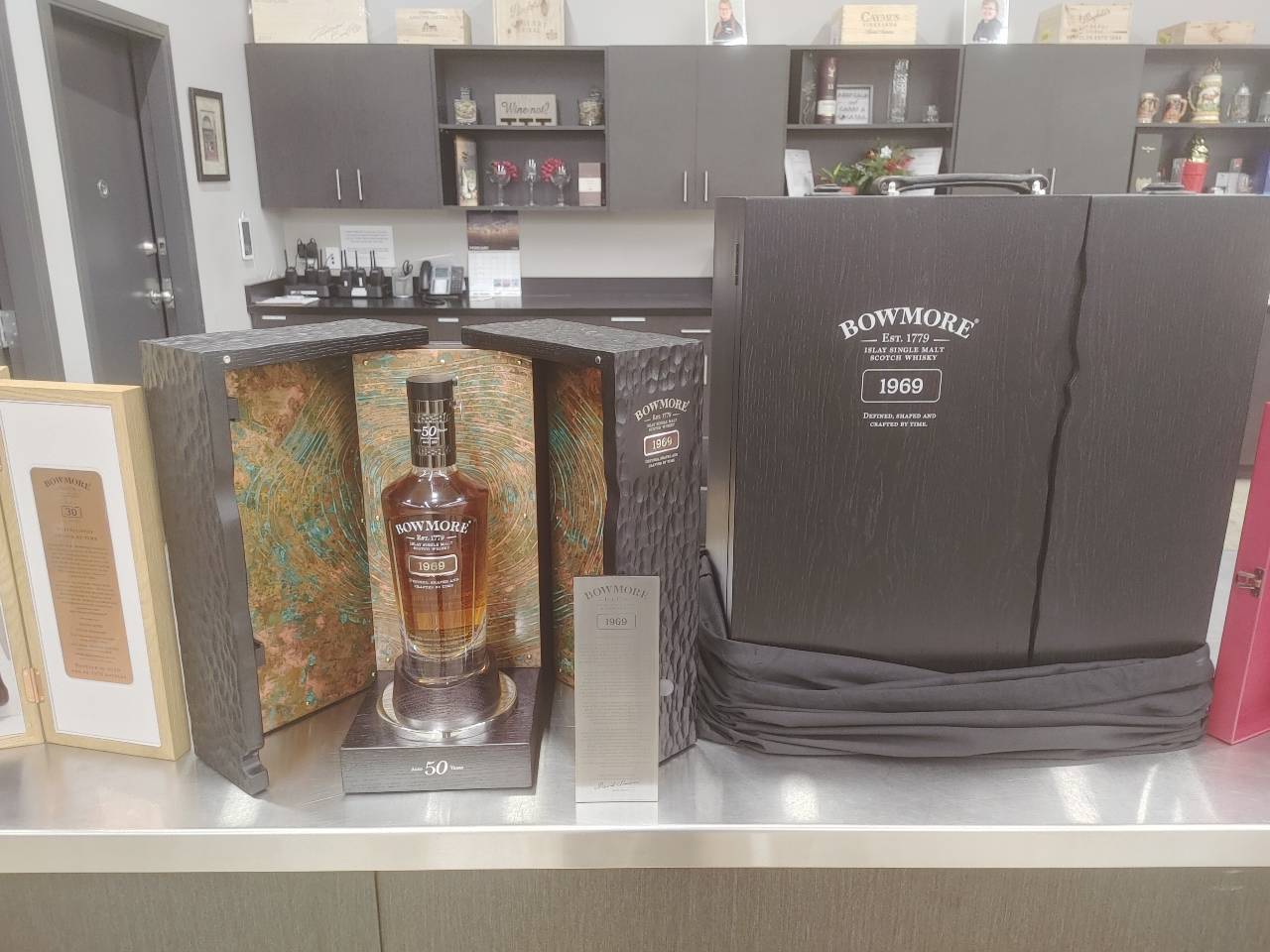 boxes of alcohol sitting on shelf