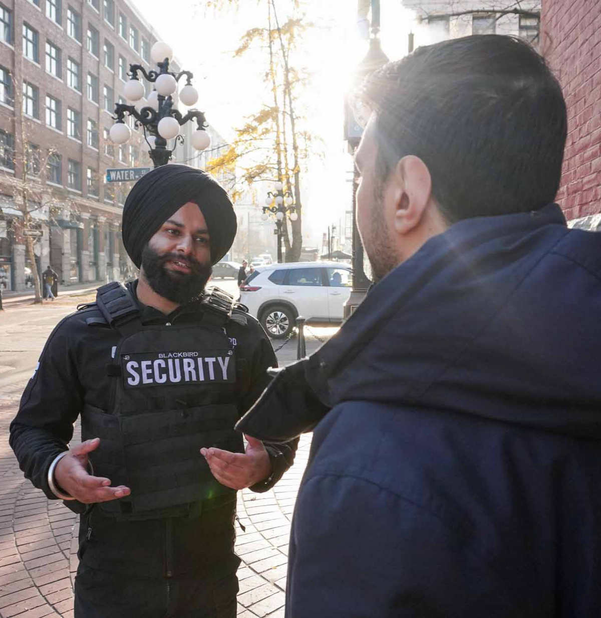 Blackbird Security guard providing customer service to a customer