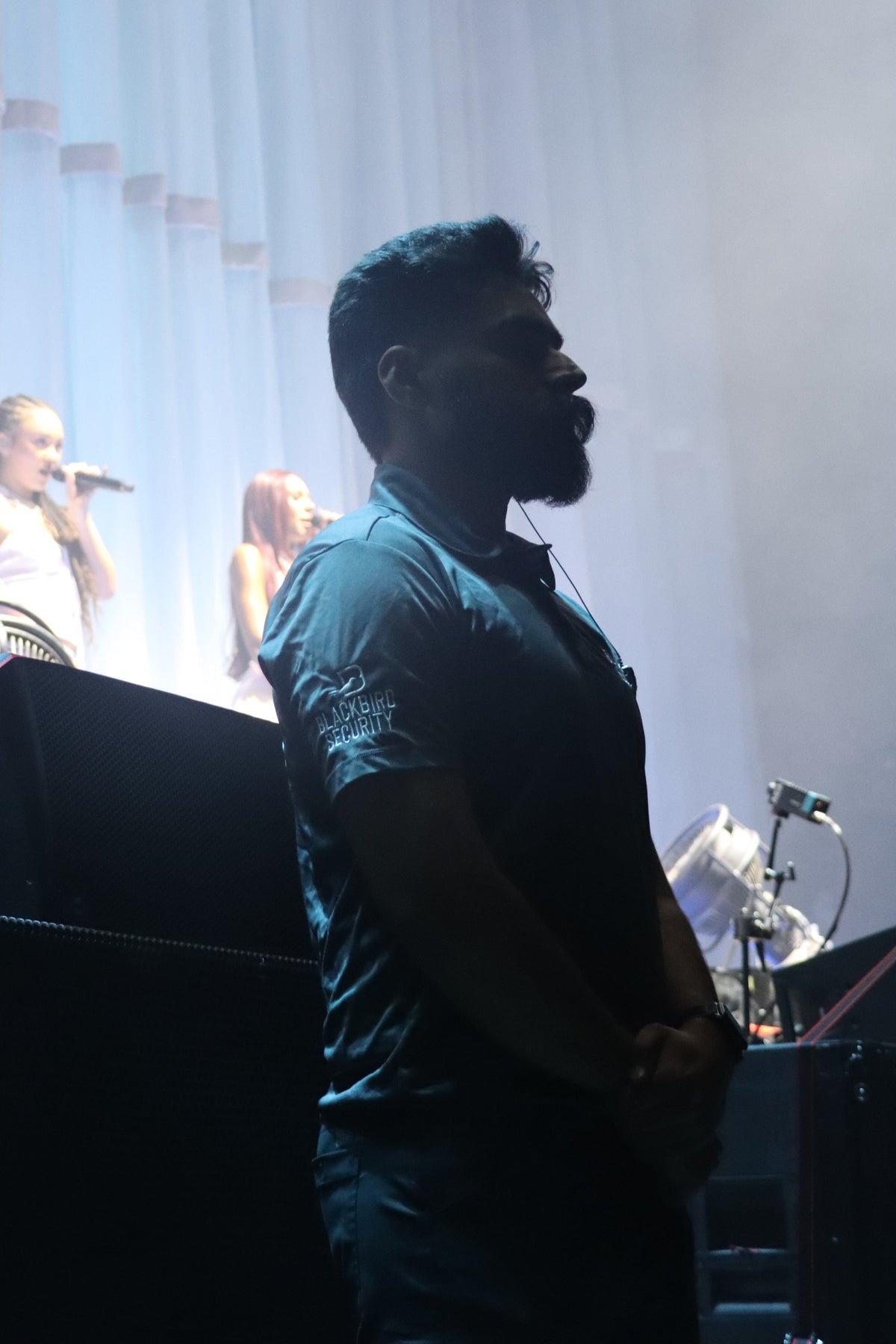 Blackbird Security Uniform Guard Protecting the stage at a Kehlani concert in Vancouver, BC.