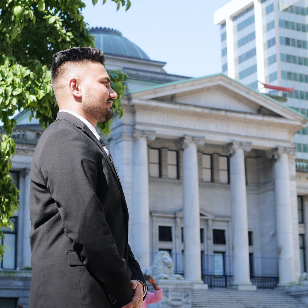 Suit and tie security guard in front of a legal/government building