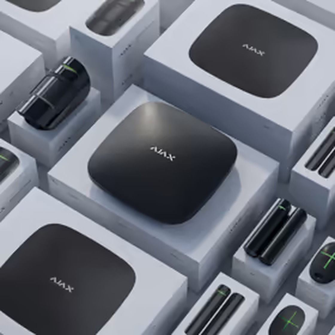 Ajax hub and sensors in packaging, ready for a system takeover.